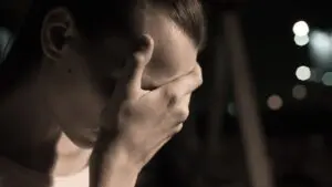 Person grieving loss of loved one from wrongful death.