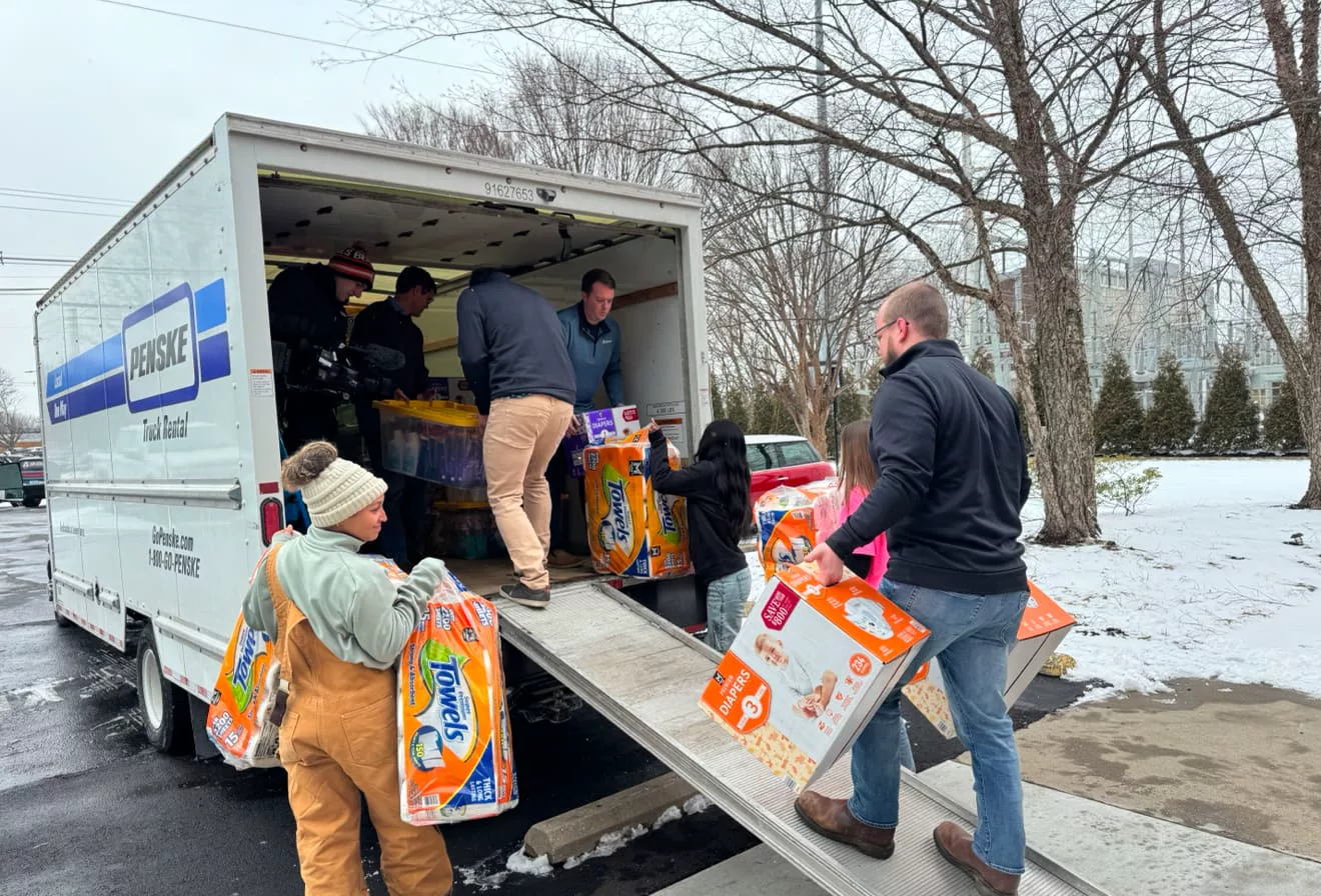 Sam Aguiar Injury Lawyers team loading a truck with donated supplies
