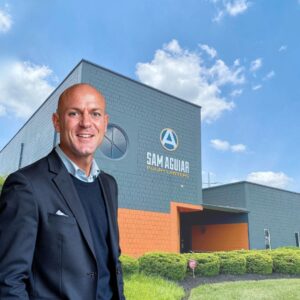 March 28, 2026 | What Clients Can Expect At Sam Aguiar Injury Lawyers Person in front of modern building.