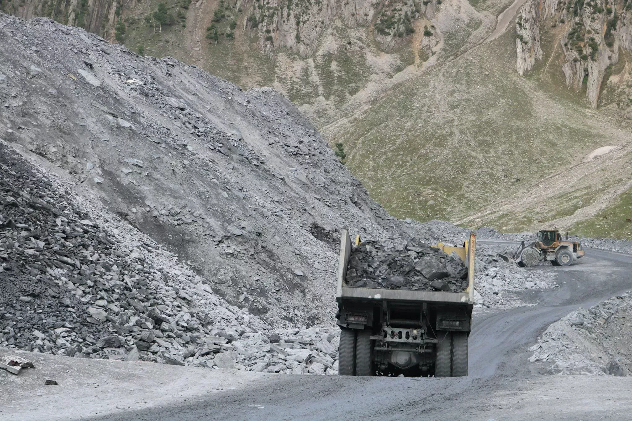 Heavy industrial dump truck and machinery, the kind of commercial traffic in Montgomery County