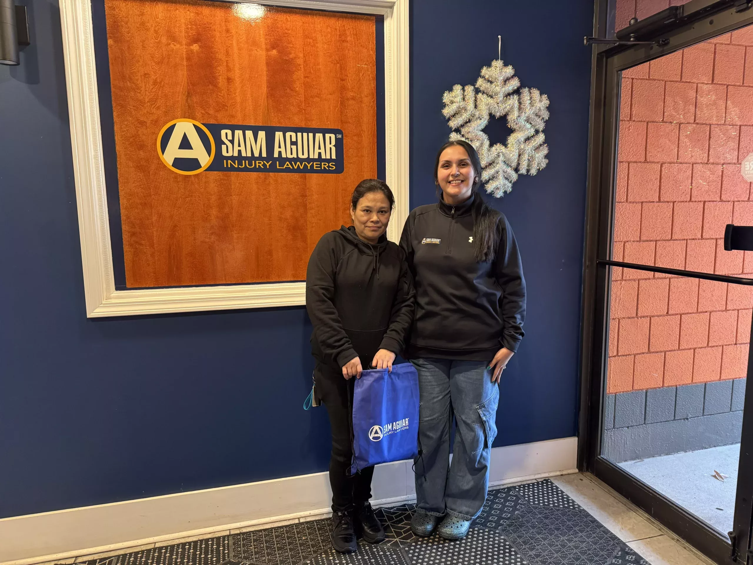 Happy spanish-speaking client at sam aguiar office