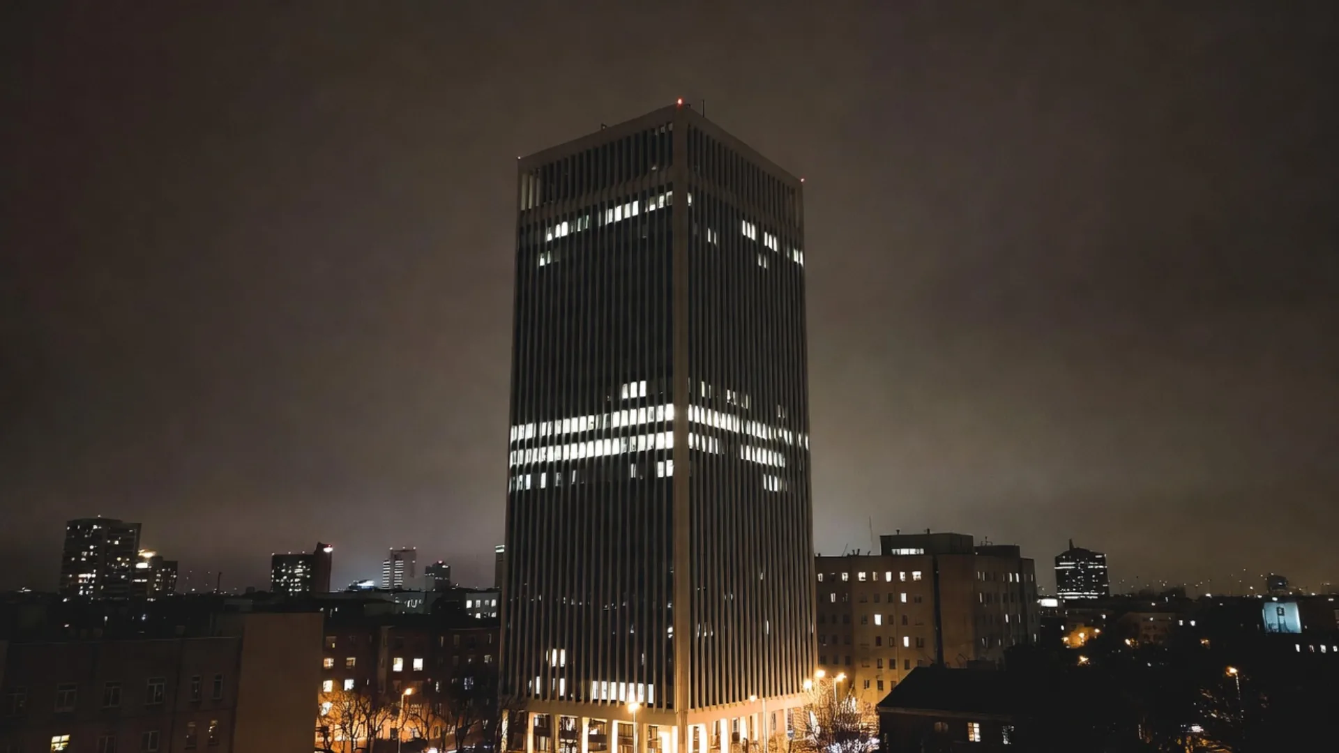 Tall insurance office tower at night