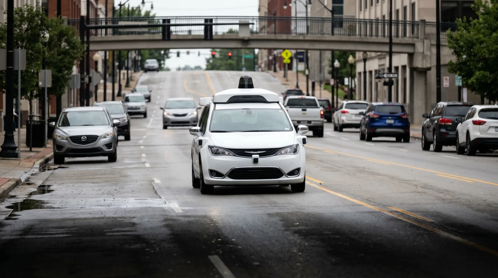 Self-driving car with a roof sensor array driving on a city street