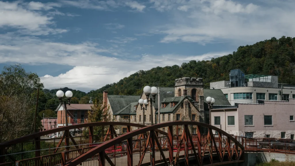Downtown Whitesburg, Kentucky with the red steel bridge and stone buildings