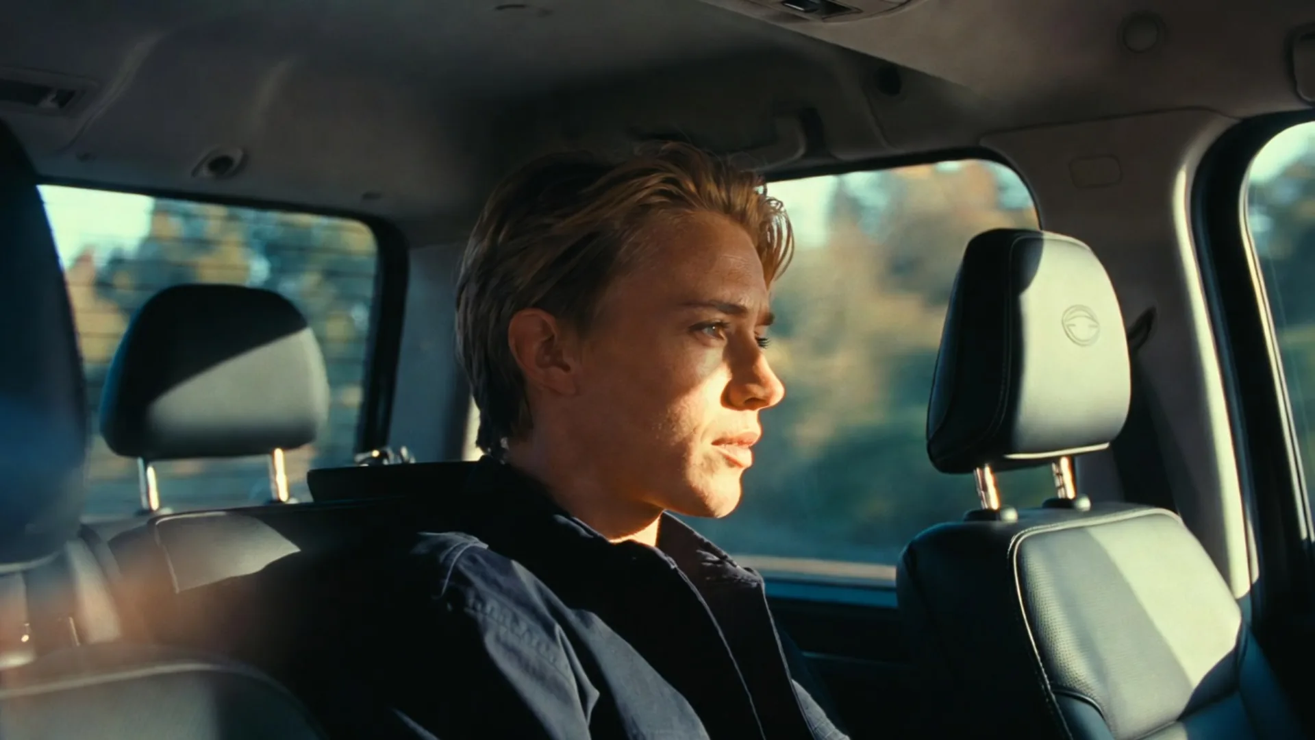 Young man sitting in a vehicle as a passenger after a car accident