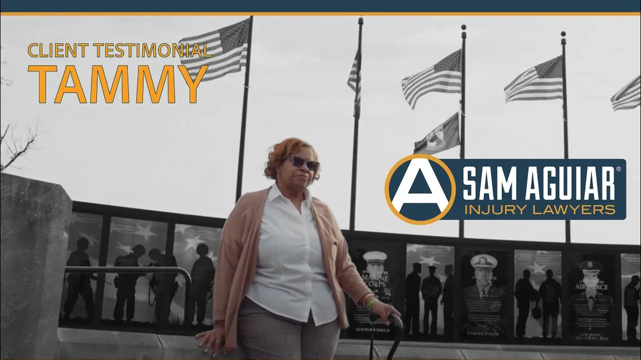Tammy standing before a row of flags under the words Client Testimonial Tammy and the firm logo