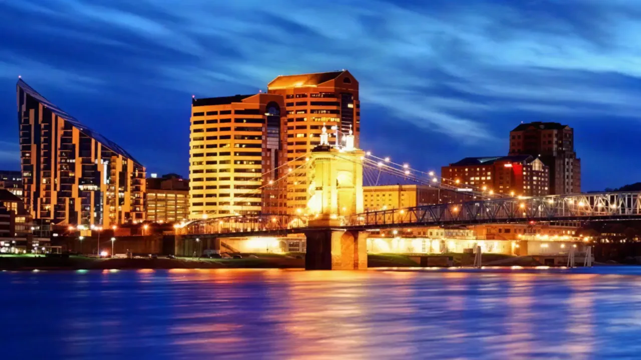 Covington riverfront and the Roebling Suspension Bridge at dusk