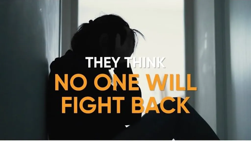 Silhouetted person sitting against a wall beneath on-screen text about what insurers assume
