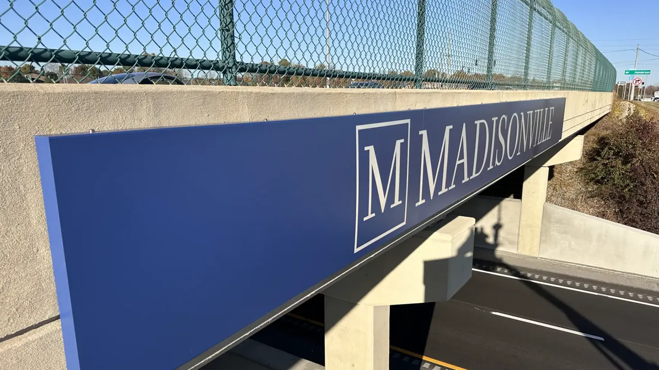 Welcome to Madisonville lettering on an overpass