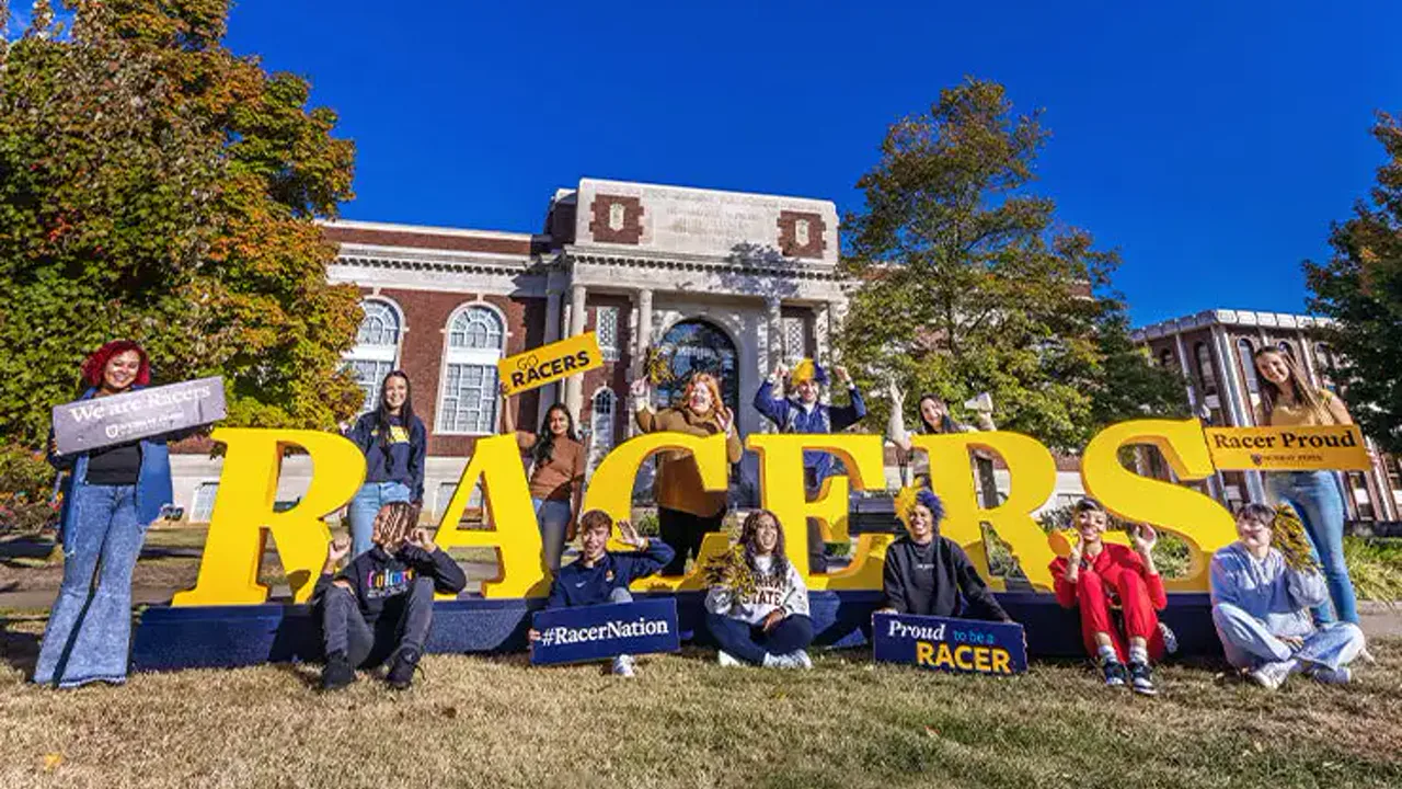 People gathered beside large Racers letters at Murray State University