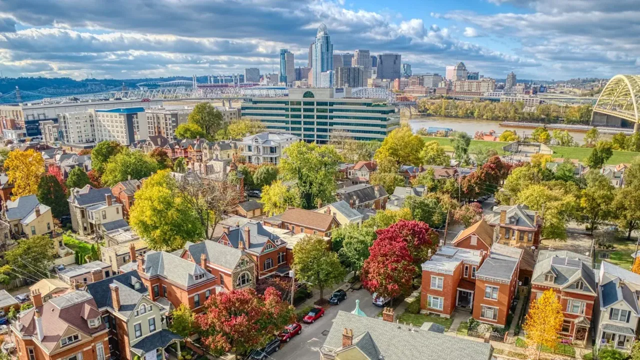 Aerial view of Newport, Kentucky's East Row historic district with the Cincinnati skyline across the Ohio River