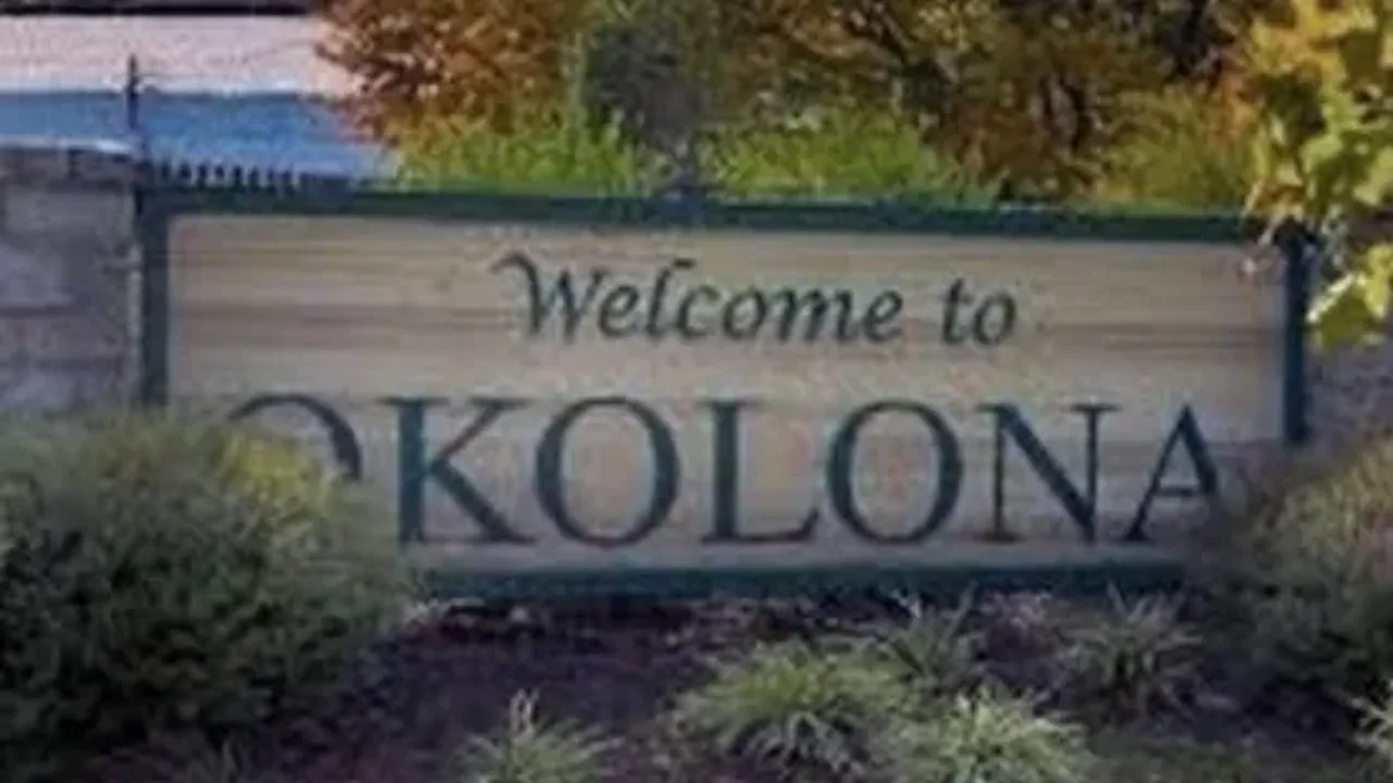 Welcome to Okolona sign in Louisville Kentucky beside autumn landscaping