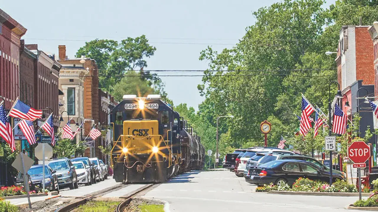 CSX freight train running down Main Street in La Grange, Oldham County, Kentucky