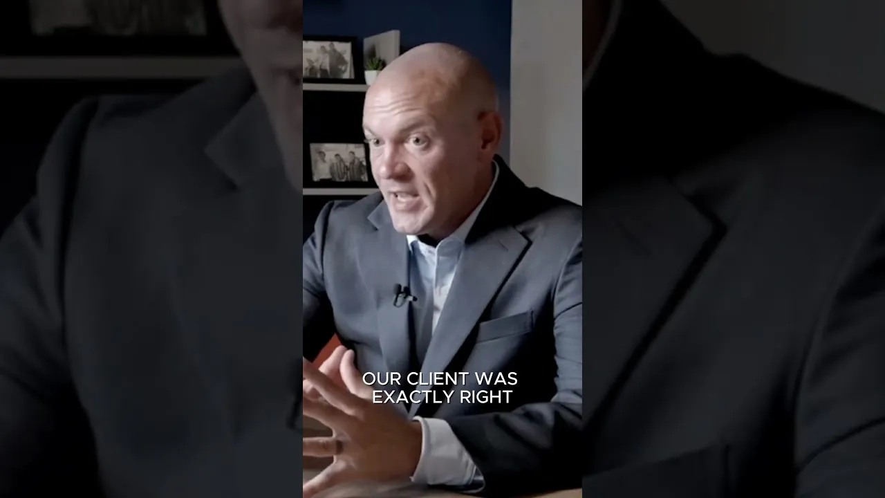 Attorney in a suit speaking to camera between two dark panels, with the caption Our client was exactly right