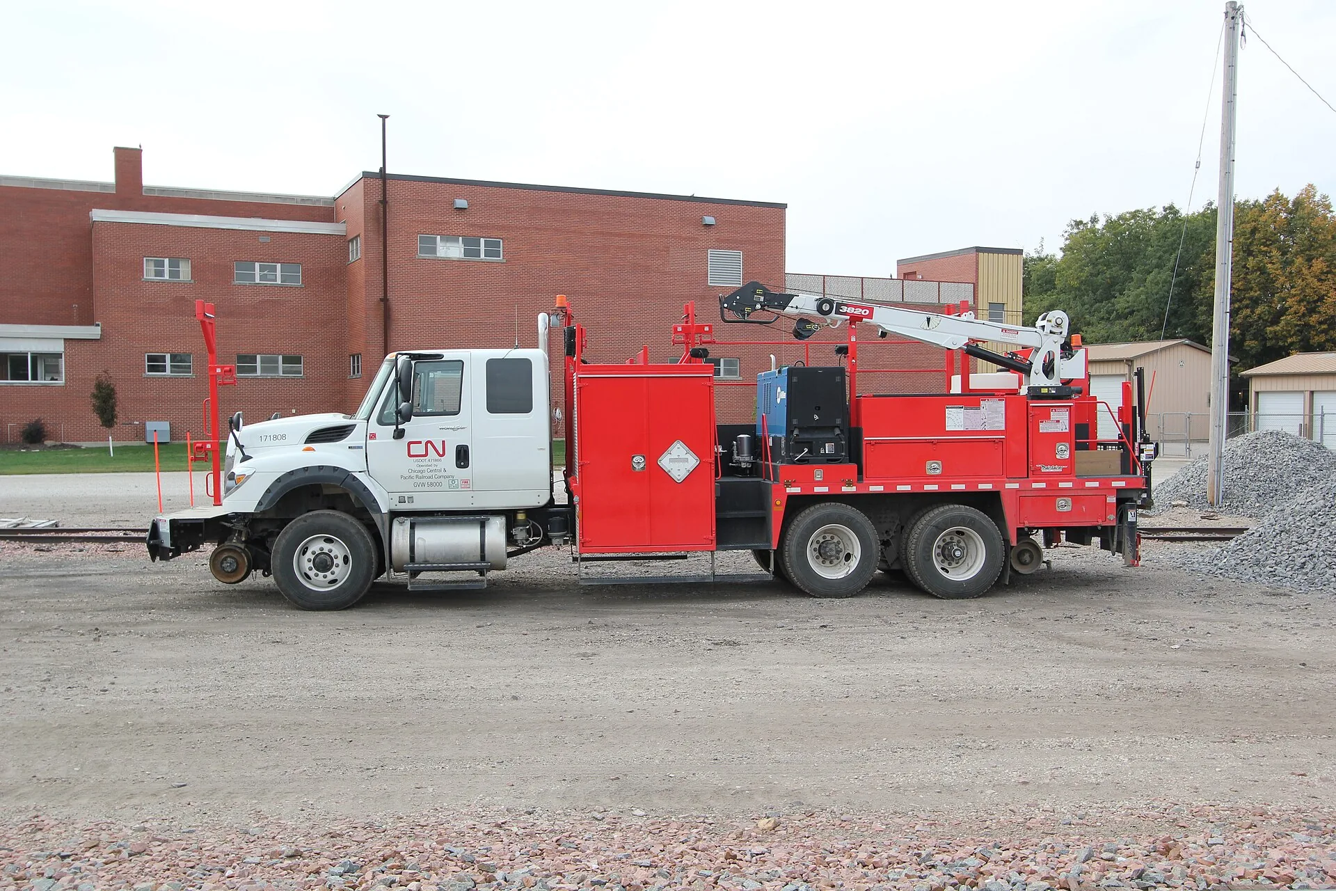CN railroad maintenance truck equipped with a crane and rail wheels