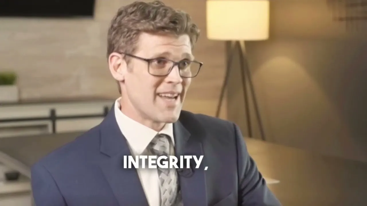 Attorney Terry Goodspeed speaking in an office with the on-screen word Integrity