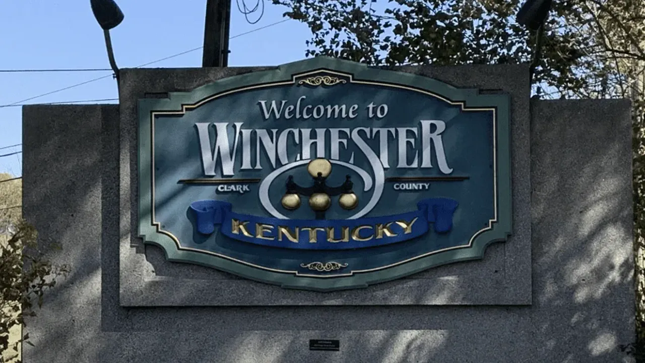 Welcome to Winchester, Clark County, Kentucky sign on a stone wall
